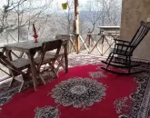 صندلی گهواره ای و میز و صندلی تراس خانه روستایی در بهشهر