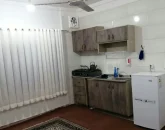 آشپزخانه، مینی یخچال، پنکه، کابینت های چوبی خانه در خلیل شهر 4854514