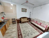 آشپزخانه با کابینت ها و گاز و اتاق پذیرایی خانه ویلایی در بهشهر 5644584