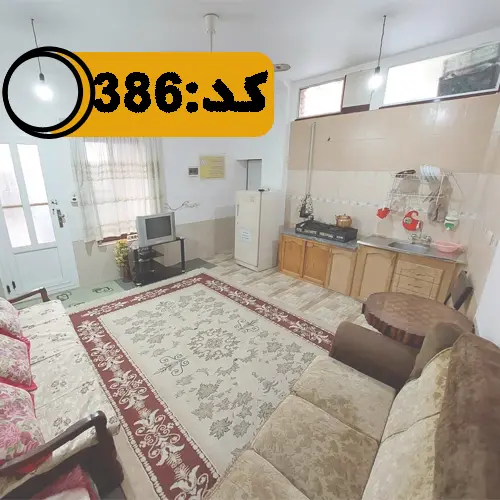 اتاق پذیرایی با میلمان و فرش، آشپزخانه خانه ویلایی در بهشهر 154456